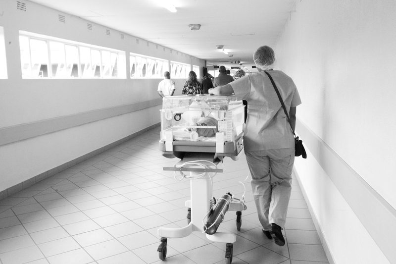 A clinician walking through a hospital corridor